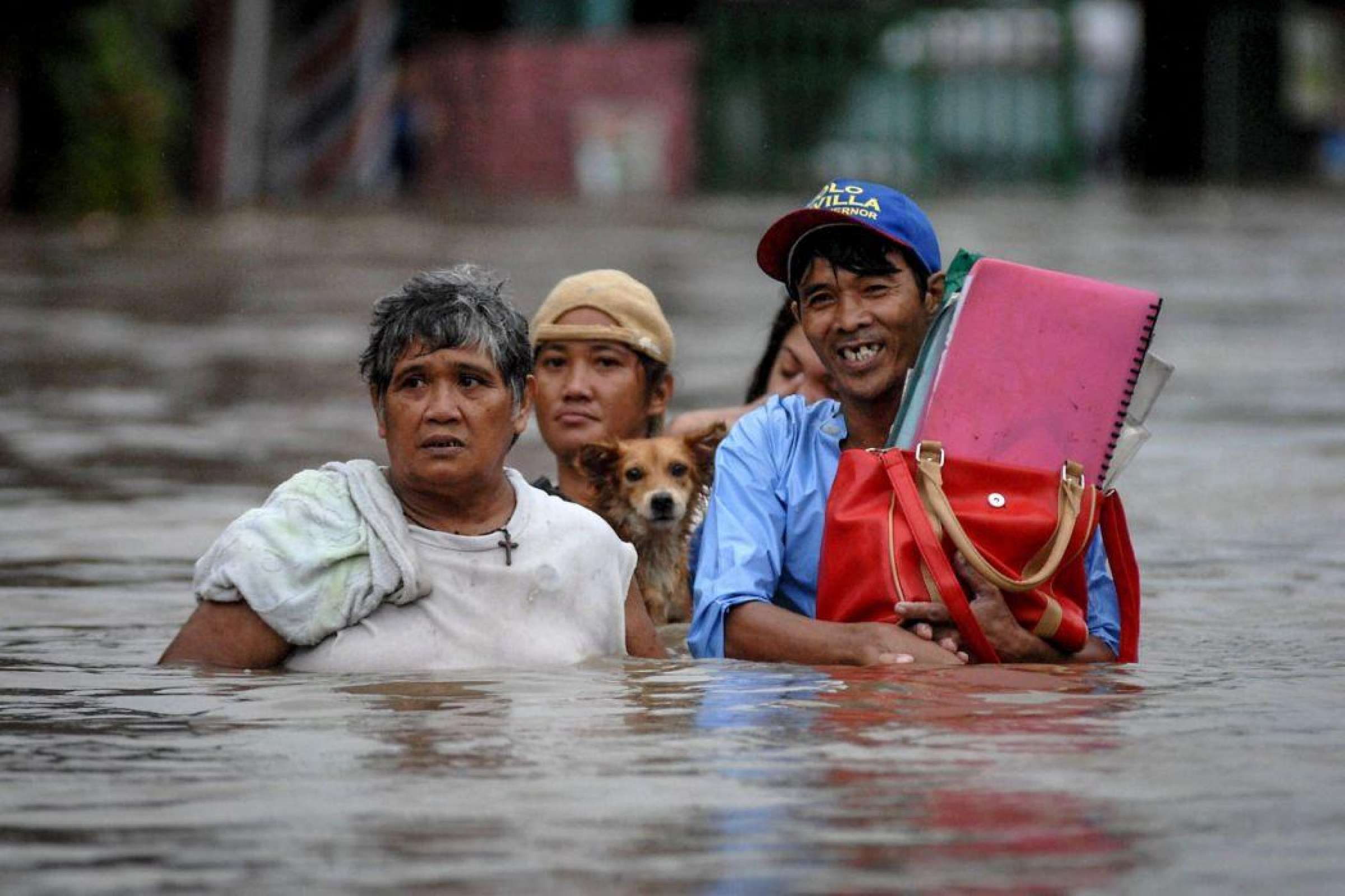Dog And Family In The Philippines In Flood